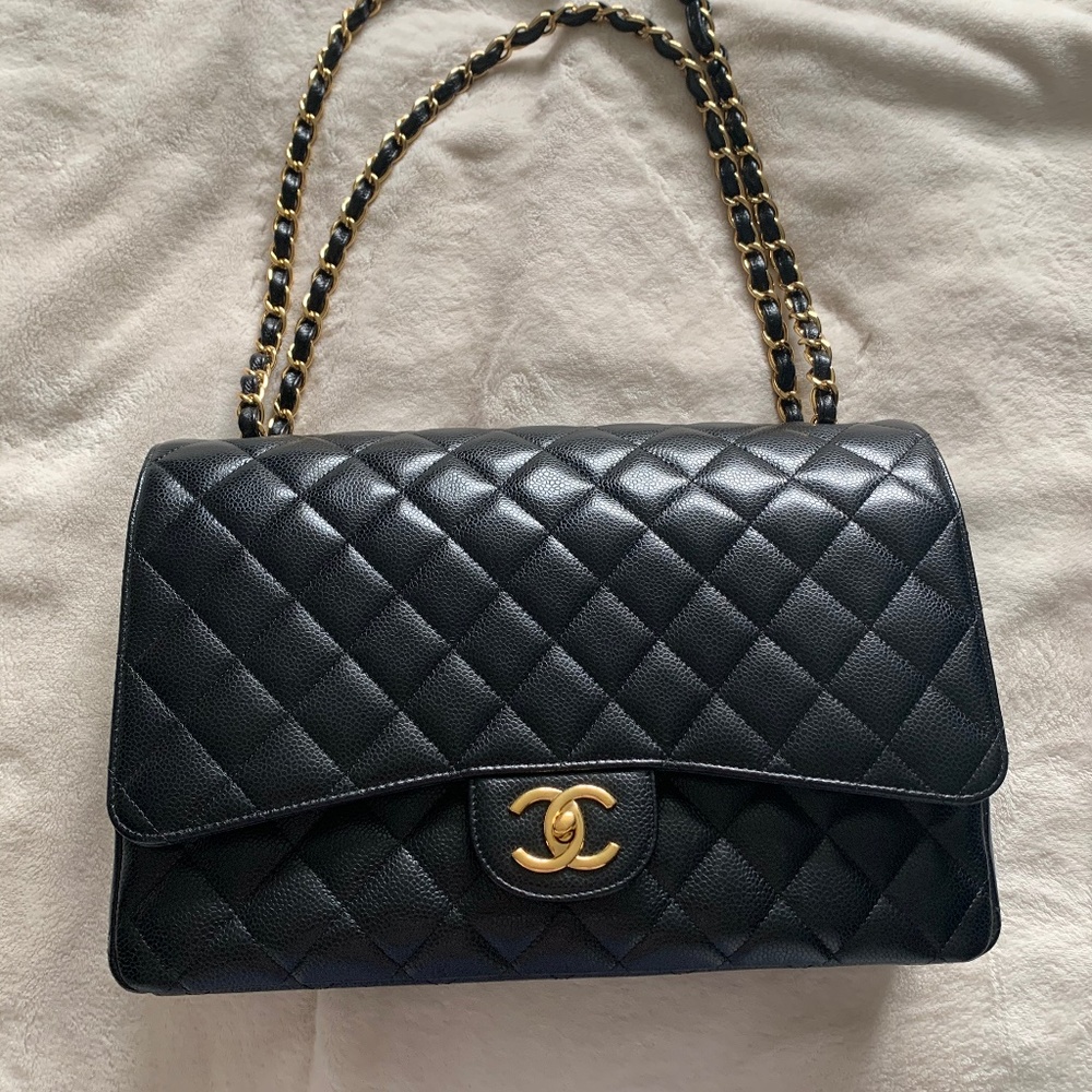 Chanel bag maxi black caviar gold hardware